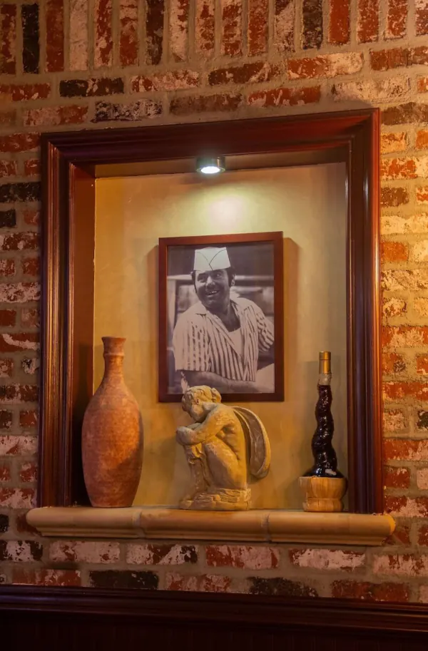 A framed photo of Nonno displayed in the restaurant